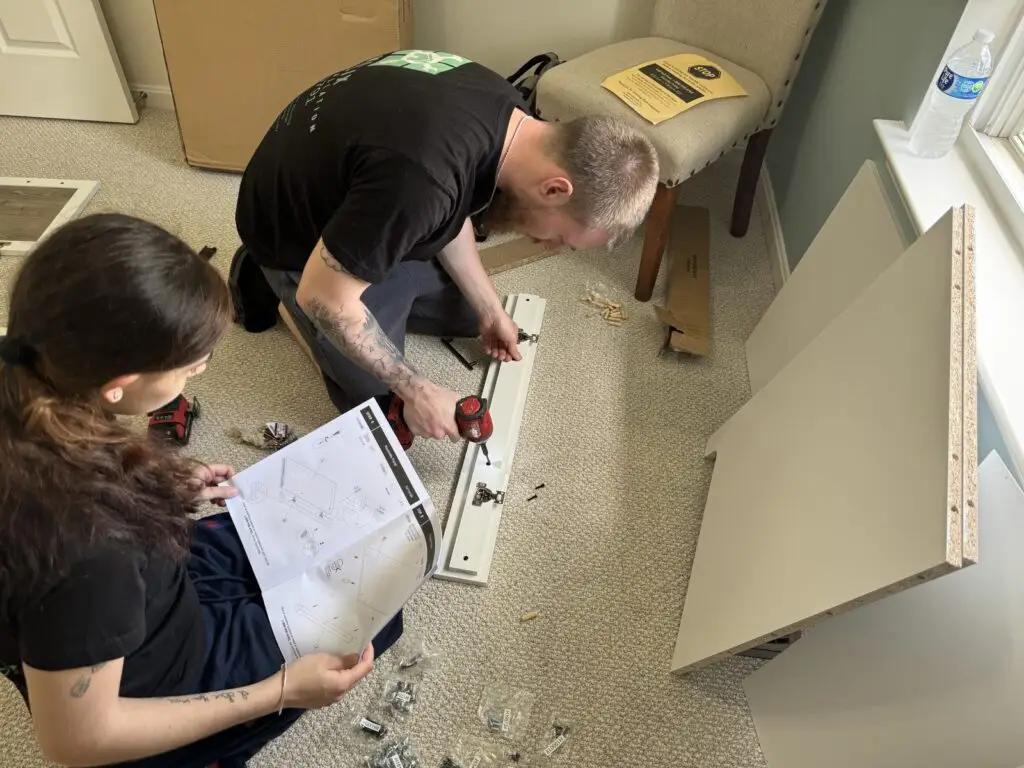 Assemblix team assembling furniture on site, following the manufacturer's instructions
