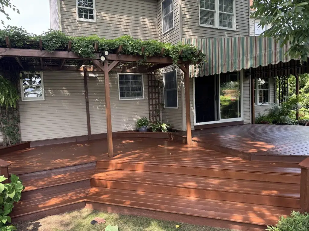 Wood pergola assembled over a backyard deck